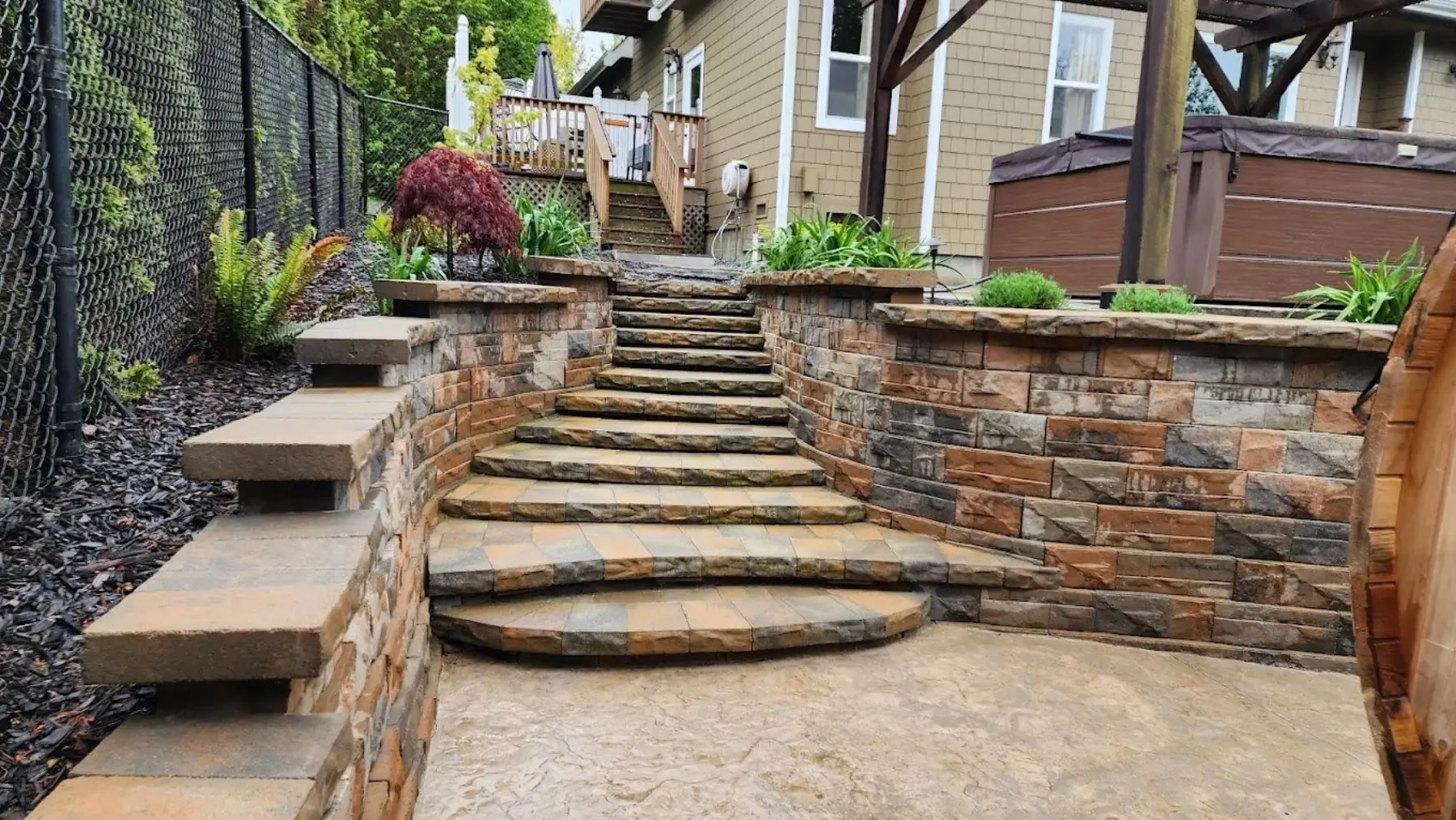 Stacked-stone steps and retaining walls built by J&G Lawn & Garden